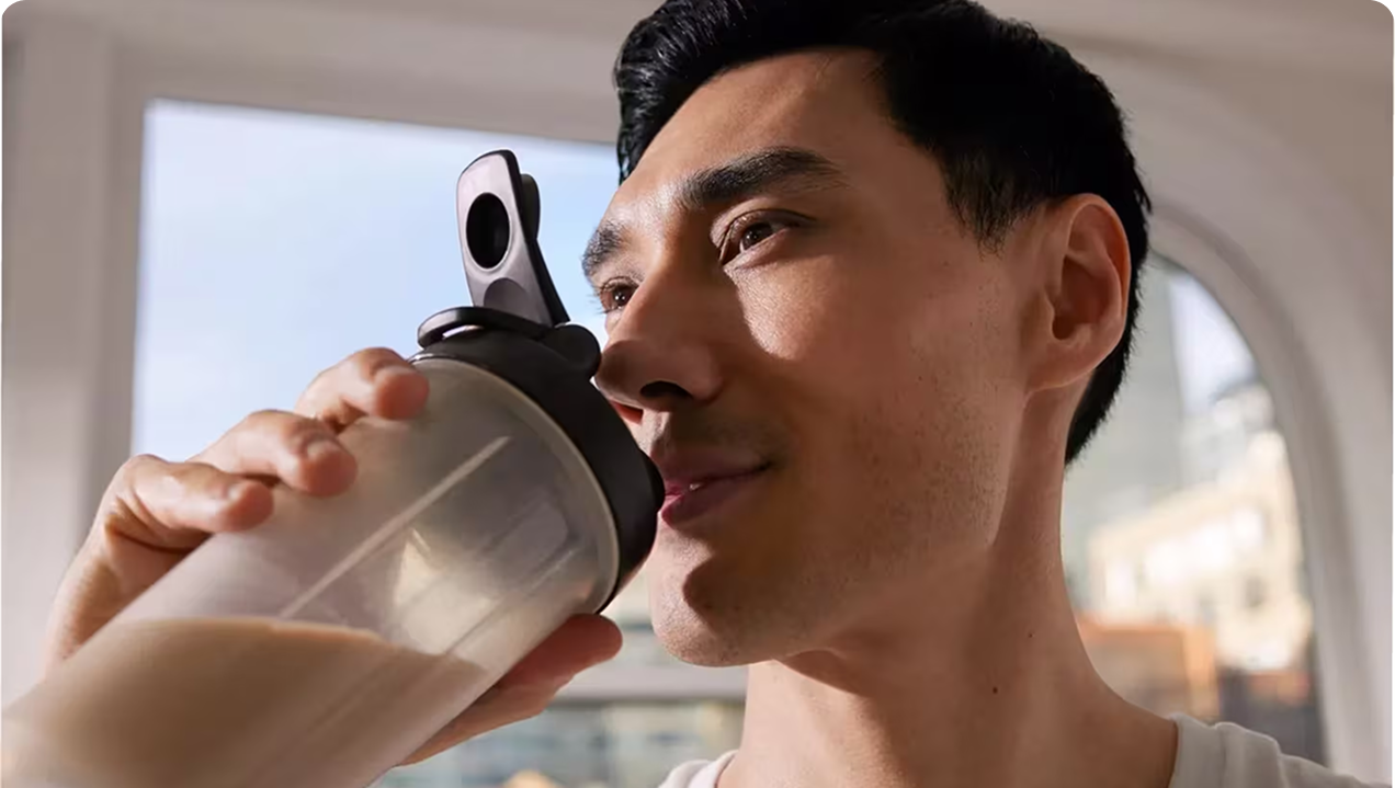 Man using Nu Skin Prysm iO wellness device
